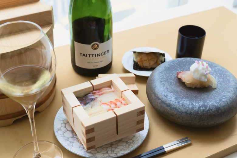 Refined sushi and champagne setting inside a contemporary Osaka hotel