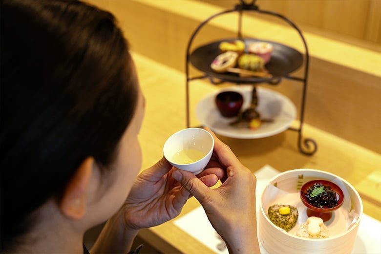 Sencha tea and small Japanese dishes arranged in a traditional tasting setting